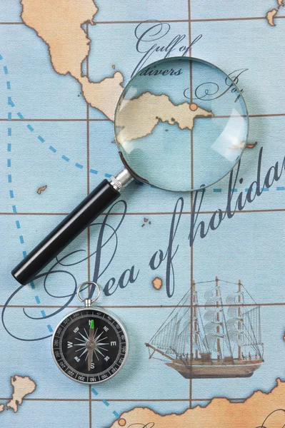 Magnifier and compass on map