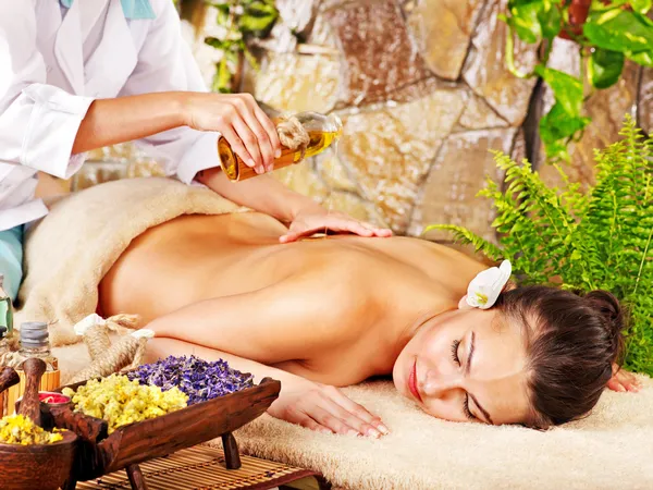 Woman getting massage in spa.