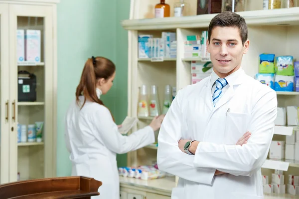 Pharmacy chemist man in drugstore