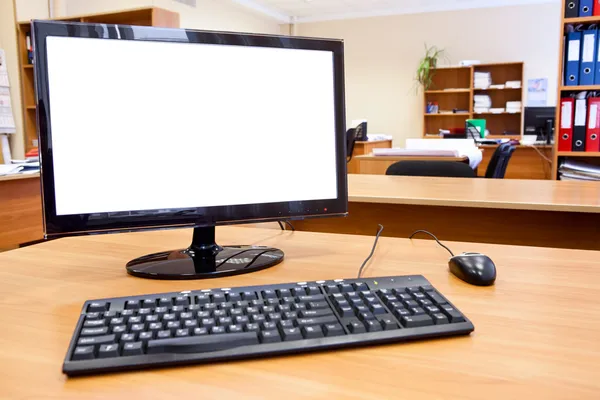 Modern personal computer on desktop in office room