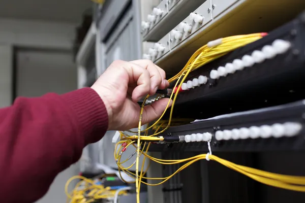IT technician connecting ODF