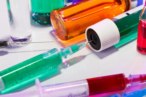 Syringe and test tube macro medical still life