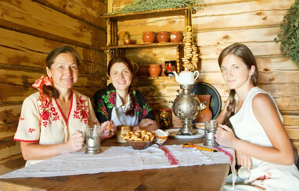 Women near traditional samovar