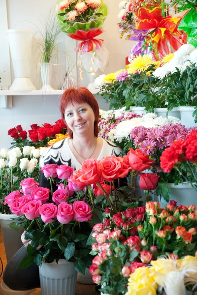 Woman in her small flower shop