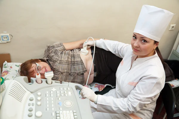 Doctor making ultrasound investigation