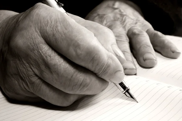 Old hands with a pen
