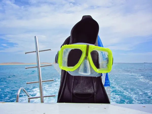 Diving fins and mask on a yacht