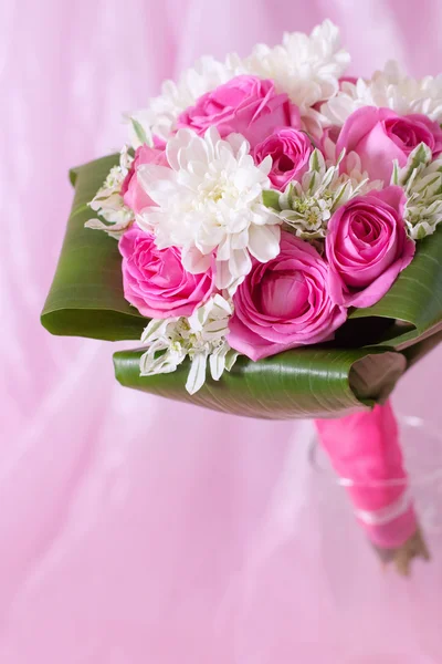 Wedding bouquet on pink background