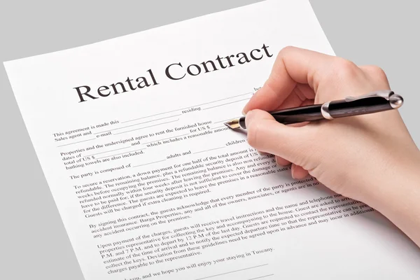 Rental contract form with pen