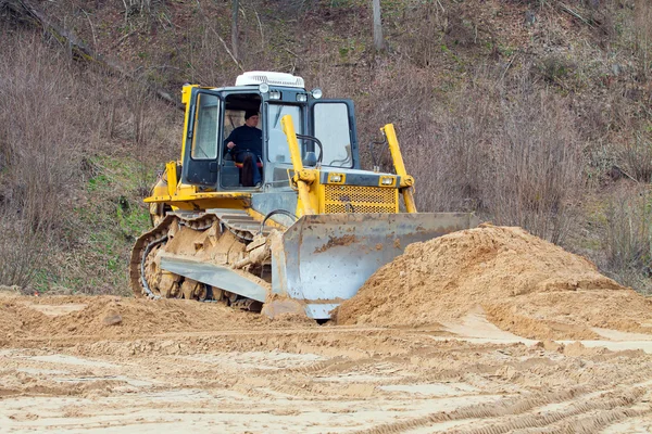 A yellow bulldozer working