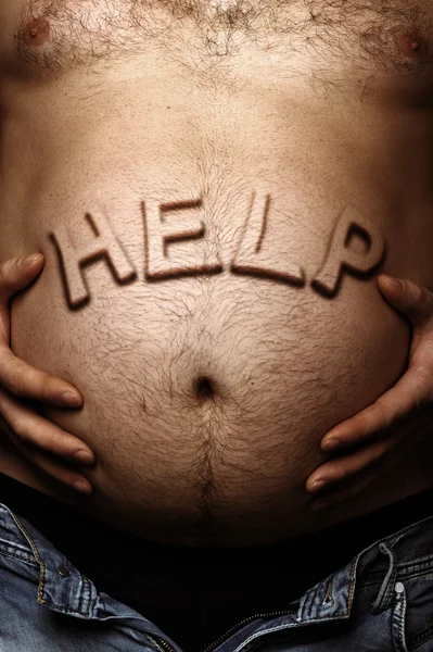 Man\'s stomach with a sticking out inscription help