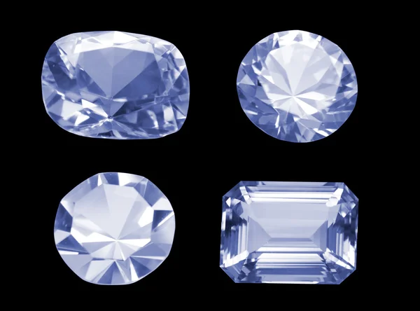 Four different shaped diamonds isolated over black