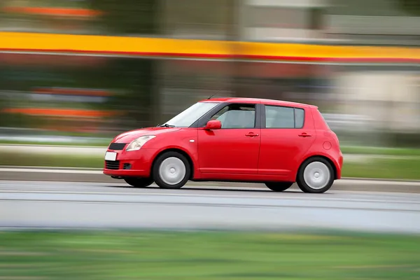 Blur small red economical family compact city car