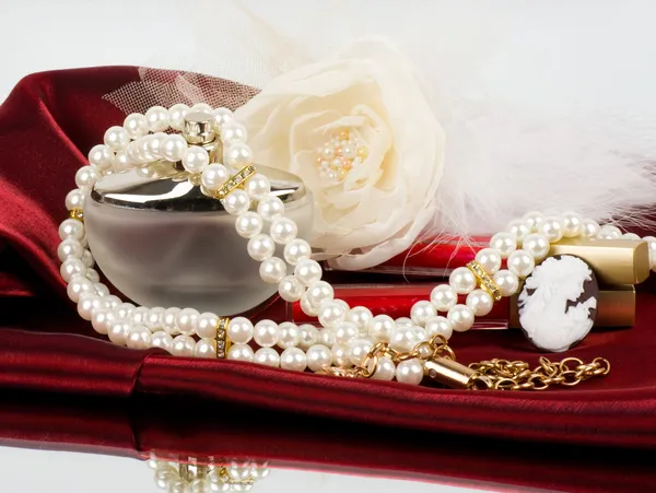 Pearl jewelry on red background