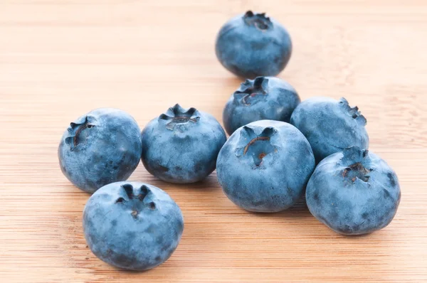 Fresh blue berries group on wooden back