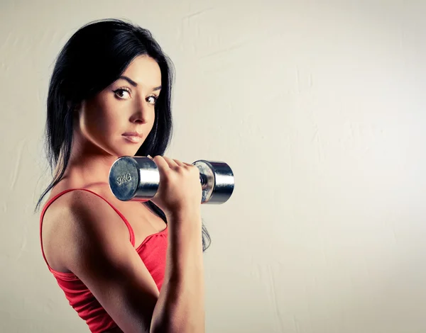 Woman with dumbbells