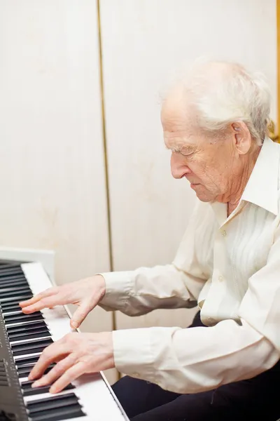 Senior Man Playing Piano