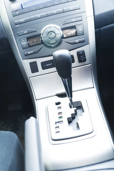 Interior of the modern car with buttons and the lever — Stock Photo #10394776