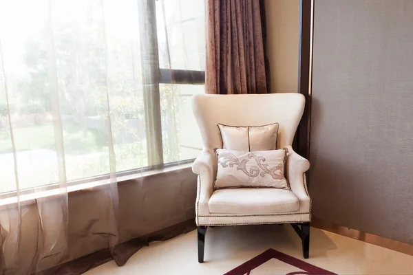 Armchair close to the window — Stock Photo #9933818