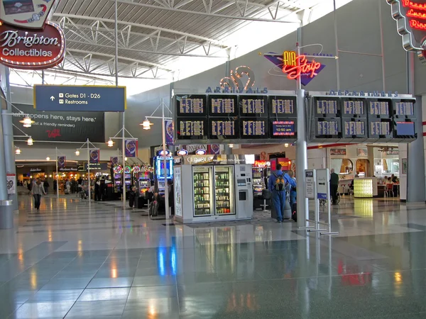 McCarran international airport interior, flight schedule and game machines.
