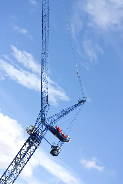 Construction crane against a blue sky