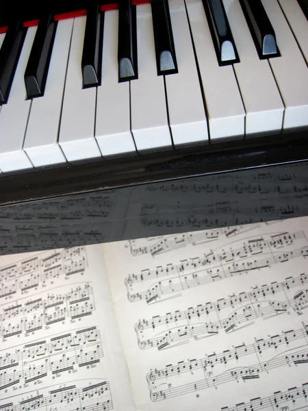 Piano keys with notes, musical background.