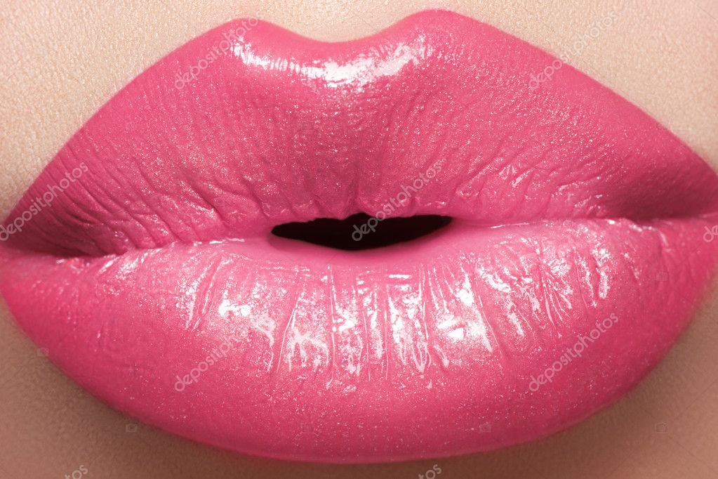 Sweet kiss. Sexy pink wet lip makeup. Closeup of beautiful full lips