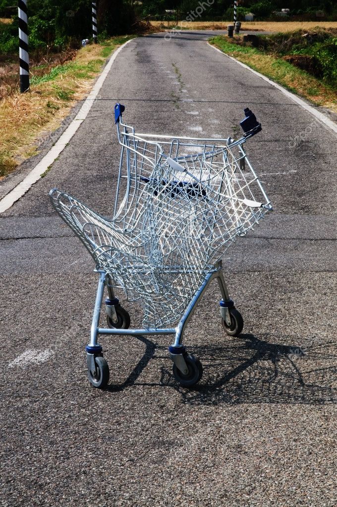 Broken shopping cart in a street campaign — Stock Photo © moreno
