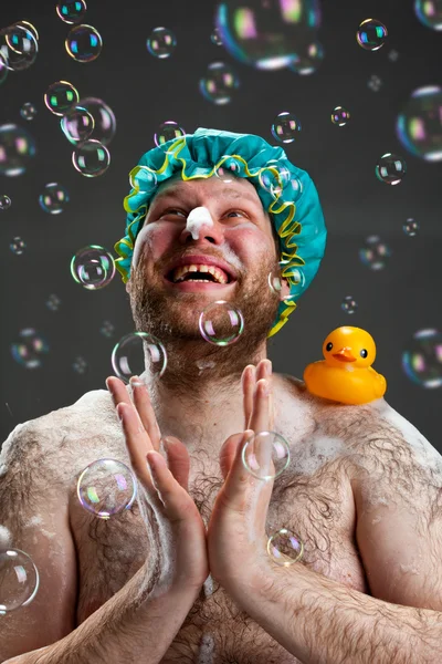 Happy man and soap bubbles