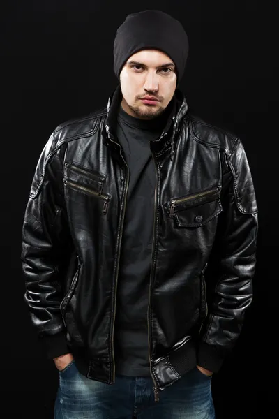 Handsome young man in black leather jacket