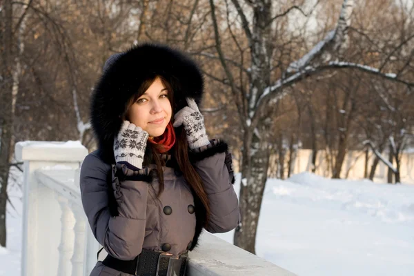 Portrait of a girl walking in park in winter