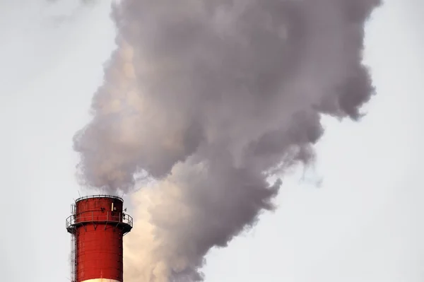 Industrial chimney releasing toxic smog clouds to atmosphere