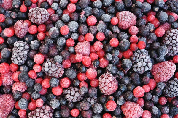 Close up of frozen mixed fruit - berries - red currant, cranberry, raspber
