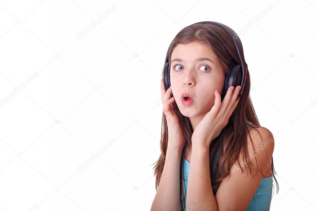 Nice teen girl listening to music with headphones