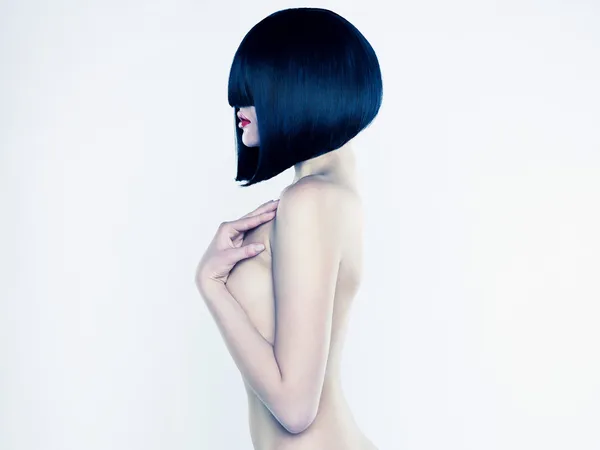 Nude woman with short hairstyle