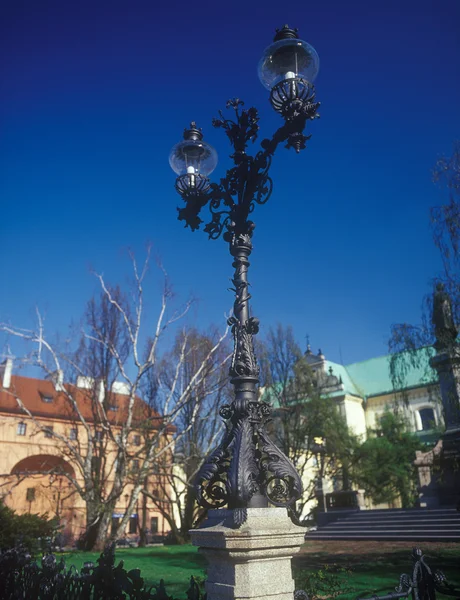 Old wrought-iron street lantern near Mickiewicz statue. Warsaw,