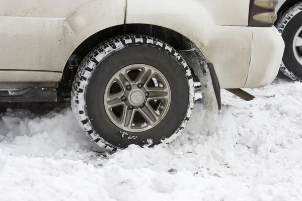 Car tires on a snowy road