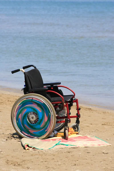 Photo of a wheelchair on the beach
