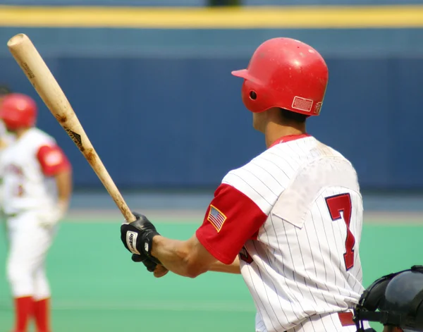 Left-handed baseball batter, close-up right-handed