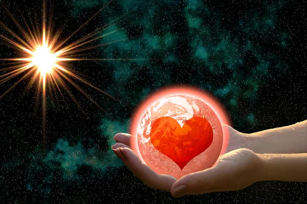 Love planet in woman hands