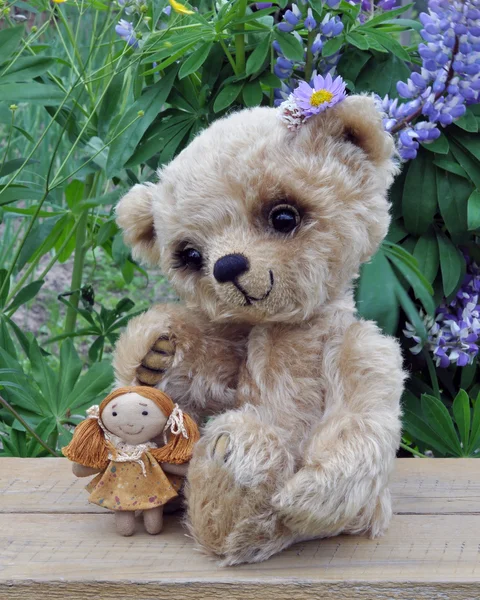 Teddy-bear Lucky with a rag doll