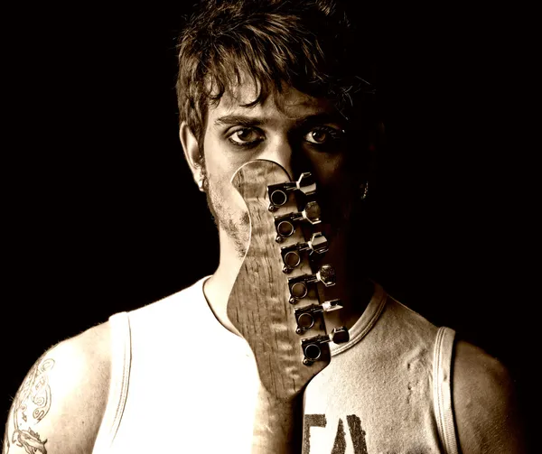 Young man with guitar portrait grunge punk rock by Daniel Garcia Mata...