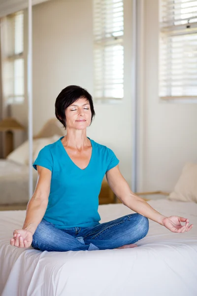 Middle aged woman yoga meditation