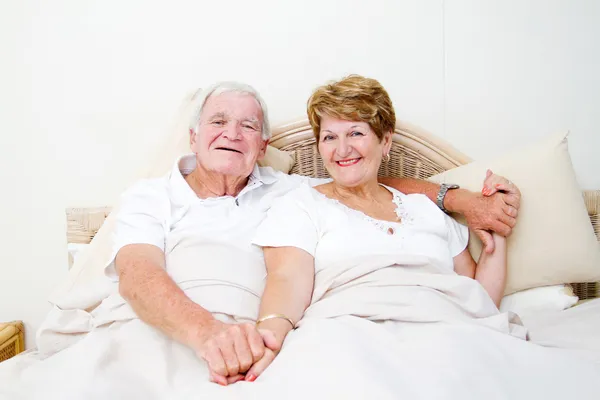 Senior couple in bed relaxing