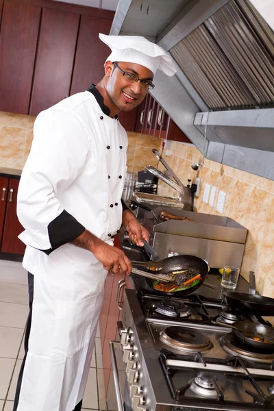 Professional chef cooking in kitchen
