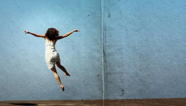 Funny jump of young woman. freedom.