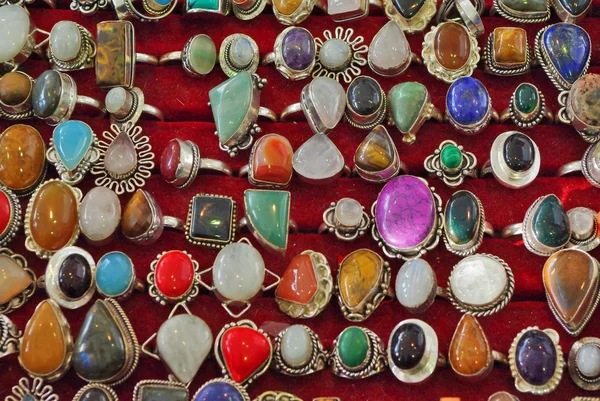 Silver rings with different semiprecious gems.