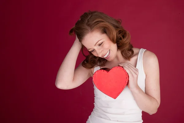 Laughing Woman Holding Heart