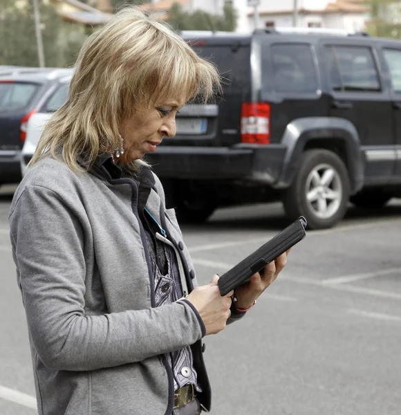 Business woman holding a contemporary digital tablet