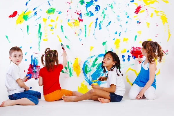 Kids painting the wall
